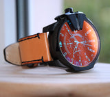 ساعة ديزل ميجا تشيف كرونوغراف رجالية، علبة سوداء مطلية بتقنية IP، سوار من الجلد البني، موديل DZ4476